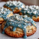 Pure Vanilla Cookie Run Kingdom sugar cookies with glossy royal icing, decorated in blue, white, and gold for a festive Cookie Run theme.  