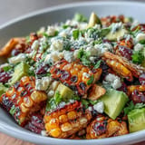 Hearty grilled corn and black bean taco salad served as a delicious, healthy summer meal.